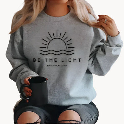Jumper med modern be the light textlogotyp på framsidan för kvinnor