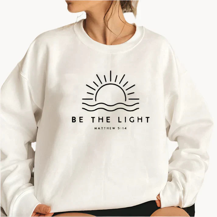 Jumper med modern be the light textlogotyp på framsidan för kvinnor