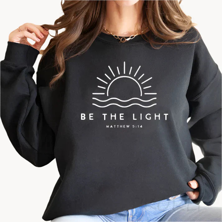 Jumper med modern be the light textlogotyp på framsidan för kvinnor