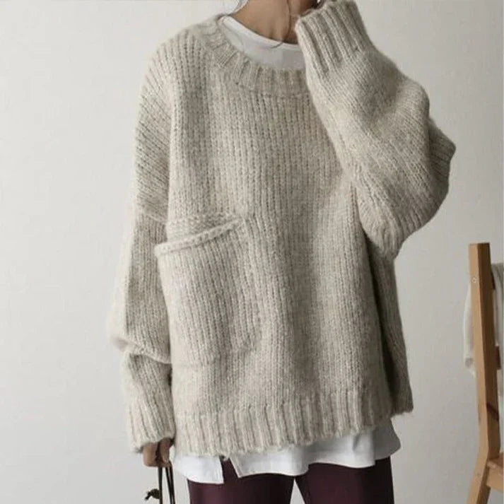 Oversized jumper med elfenbensfärgad framficka och stora, djupa fickor för kvinnor