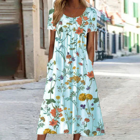Charlotte - blommig midi sommarklänning hona