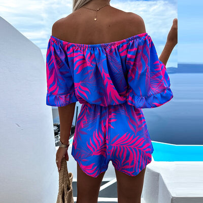 Blå off shoulder playsuit med rosa tryck