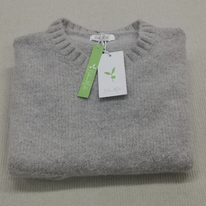 Oversized jumper med elfenbensfärgad framficka och stora, djupa fickor för kvinnor